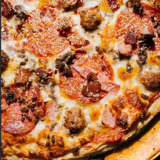 meat-lovers wood fired pizza